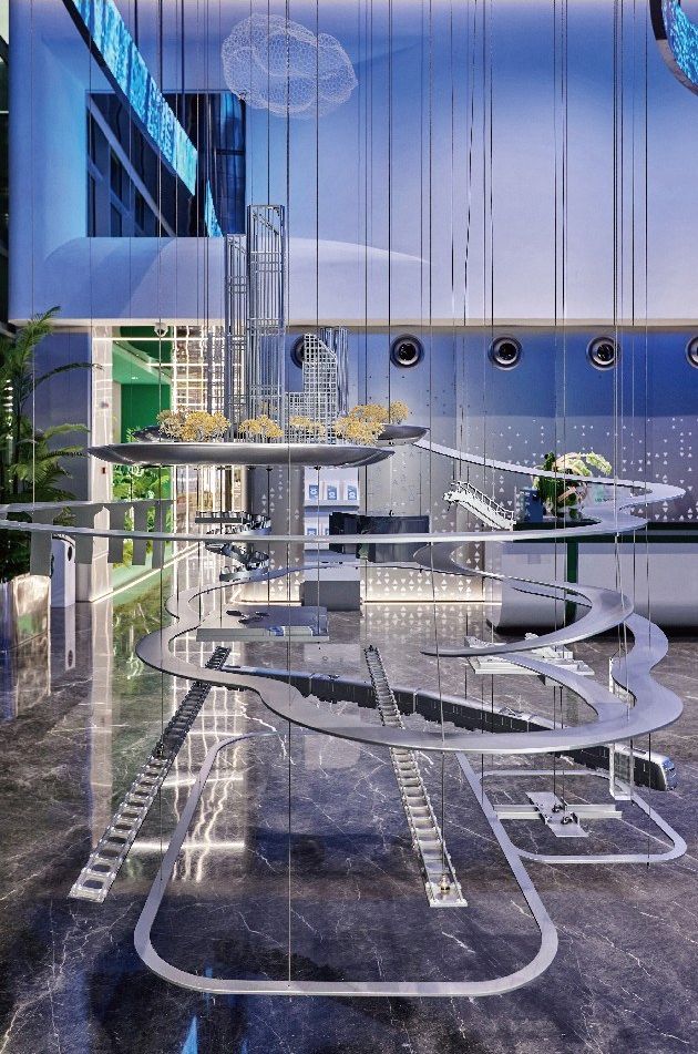 Suspended art installation in oval layers with a transparent tower model