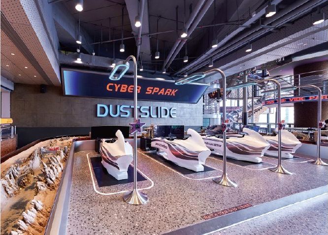 Racing hall with a long metal track and simulator seats