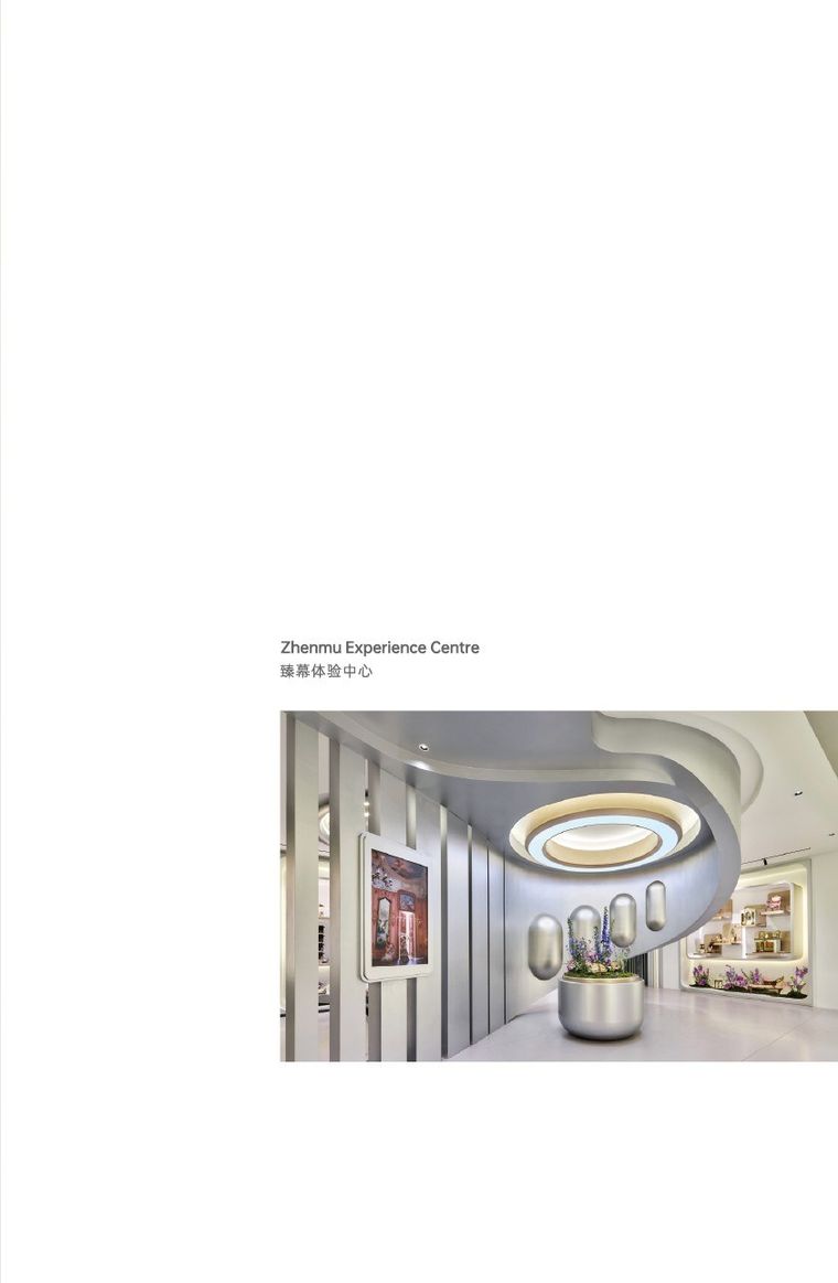Exhibition hall with a sculpted ceiling and a planted trough along the corridor