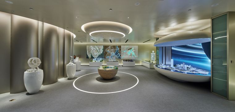 Showroom with circular display units and concealed lighting