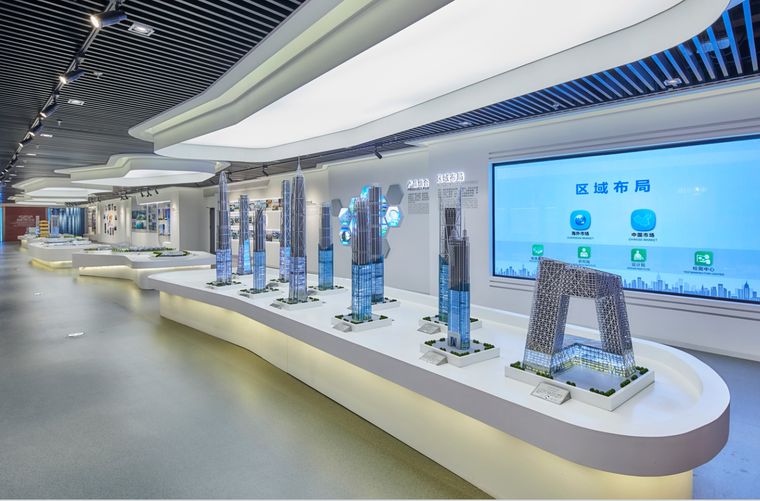 Exhibition hall with tower models and information screens