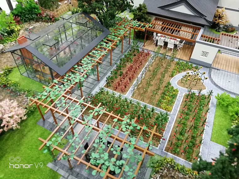 Greenhouses and productive gardens on a display base