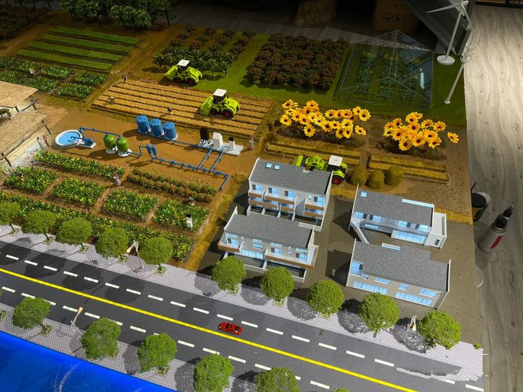 Farming village with houses, fields and service roads