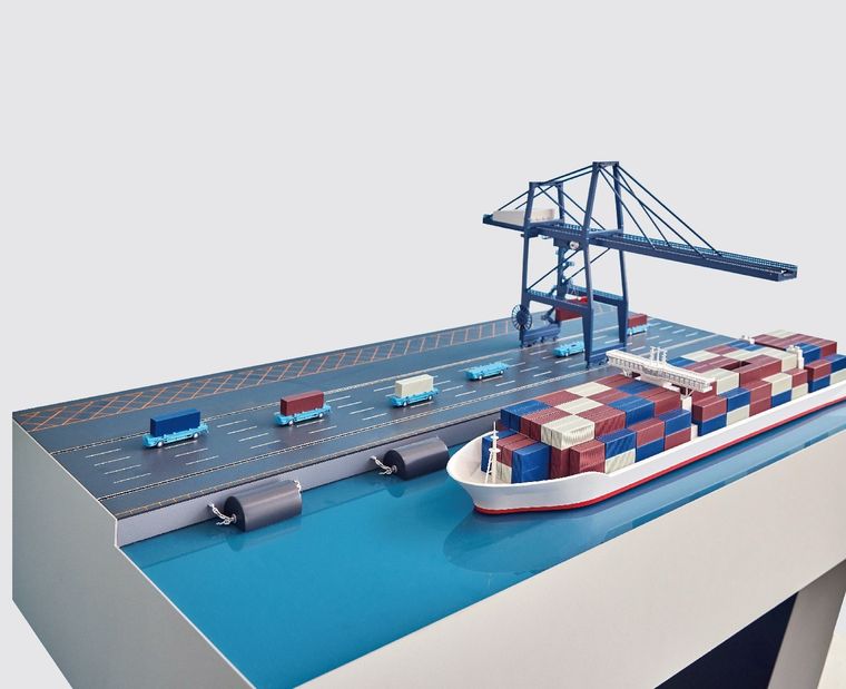 Model of a container port with the crane, the ship and the trucks