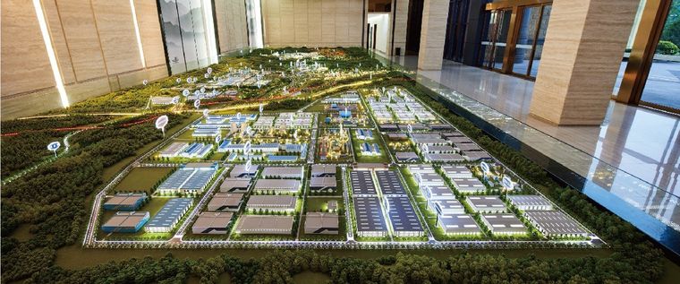 Model of an industrial zone extending through a glass lobby