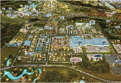 Model of an industrial city lit at night with zone labels