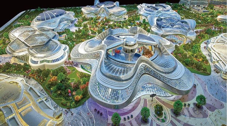 Model of a tourism complex with curved glass roofs and gardens