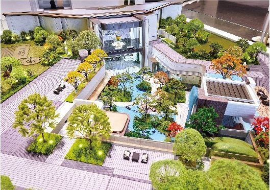 Model of a residential courtyard with streams, walkways and lawns