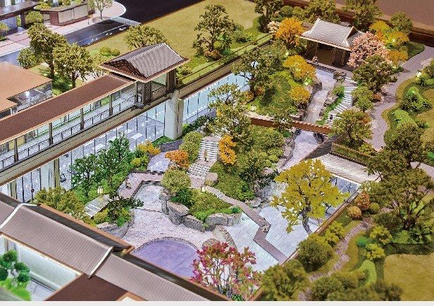 Model of a traditional-style garden with bridges, walkways and trees