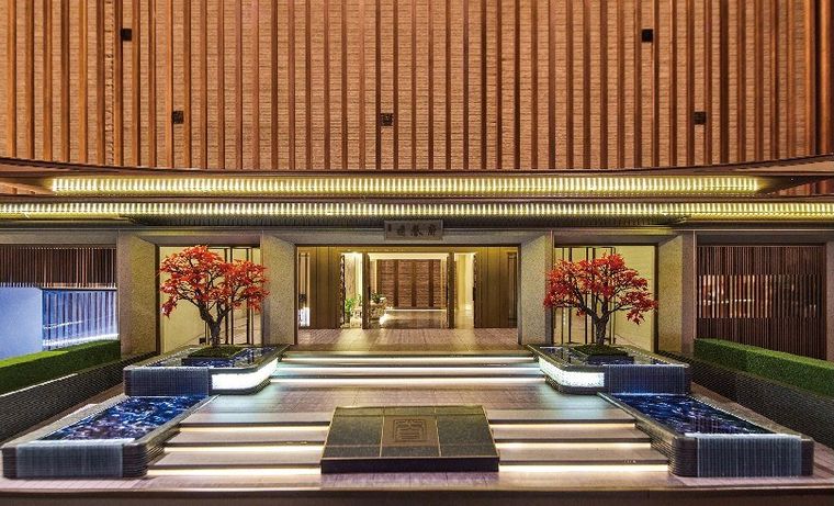 Model of a luxury entrance with water features, a broad stair and red trees
