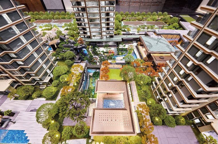 Model of a courtyard between residential towers with pools and landscaping