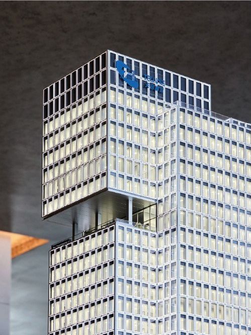 Close view of a glazed office tower facade showing the floor detail