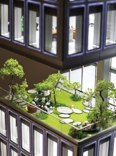 Cutaway model of a roof garden between the floors of an office building