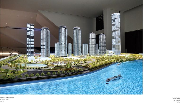 Model of a business centre with a glazed facade and site landscaping