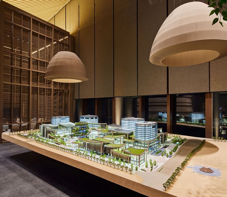 Commercial complex model in a showroom under soft lighting