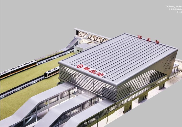 Model of a white modernist building within an exhibition on the history of architecture