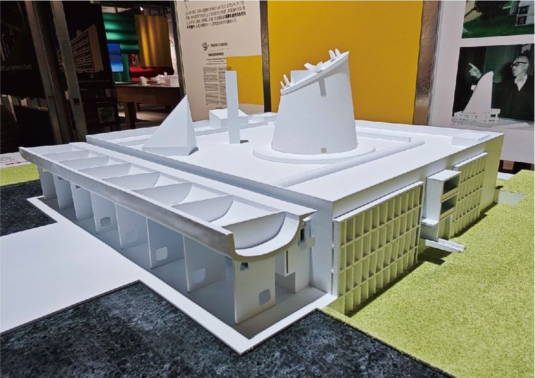 Model of a white cultural building with interlocking curves