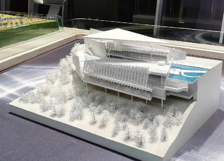 Model of a cultural building on a white base in an exhibition hall