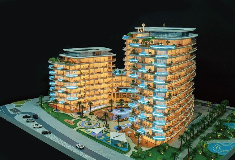 Model of a residential resort with low-rise buildings, pools and golden light