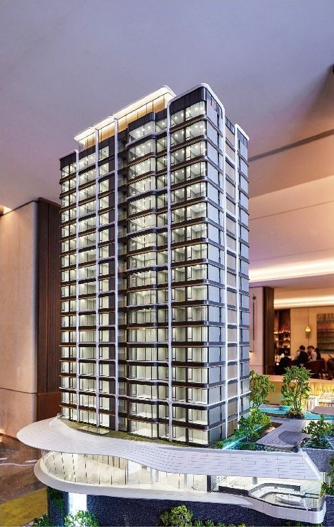 Model of a slender residential tower in a sales lobby