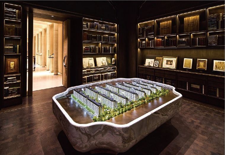 Model of a residential district inside a white marble basin in a library