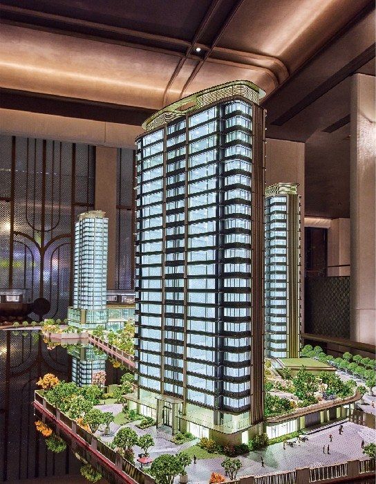 Model of two residential towers with the retail podium and gardens