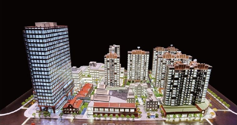 Model of a residential and retail complex with buildings stepping in height
