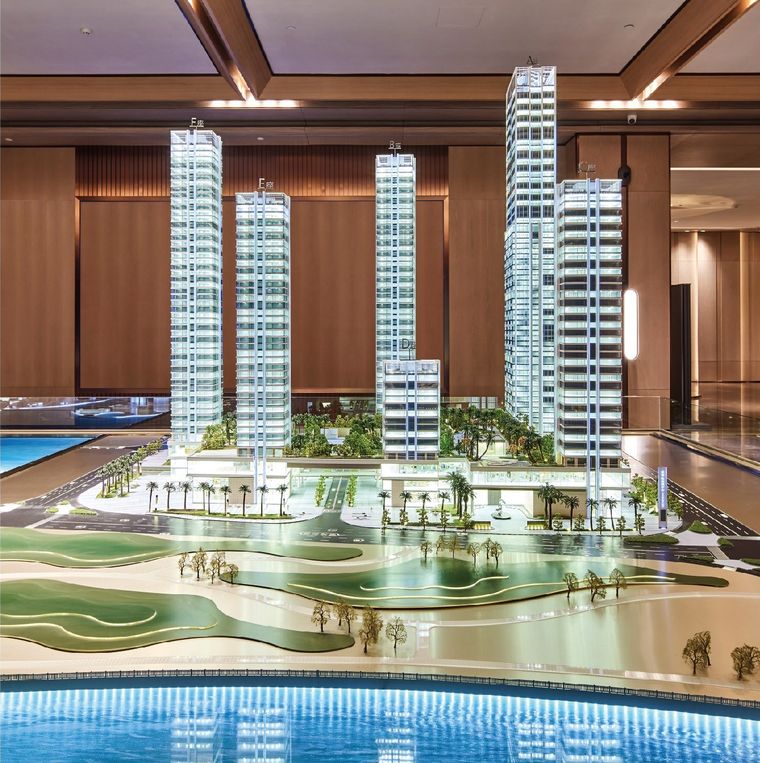 Model of a residential project with a water frontage in a colonnaded lobby