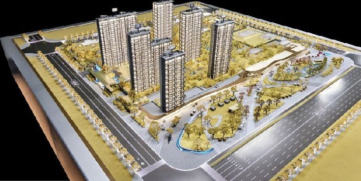 Model of a residential complex with roads and plazas on a yellow base