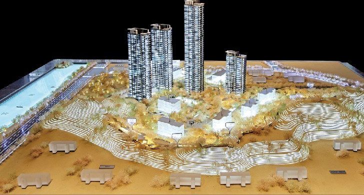 Model of a residential project on stepped terrain, lit at night
