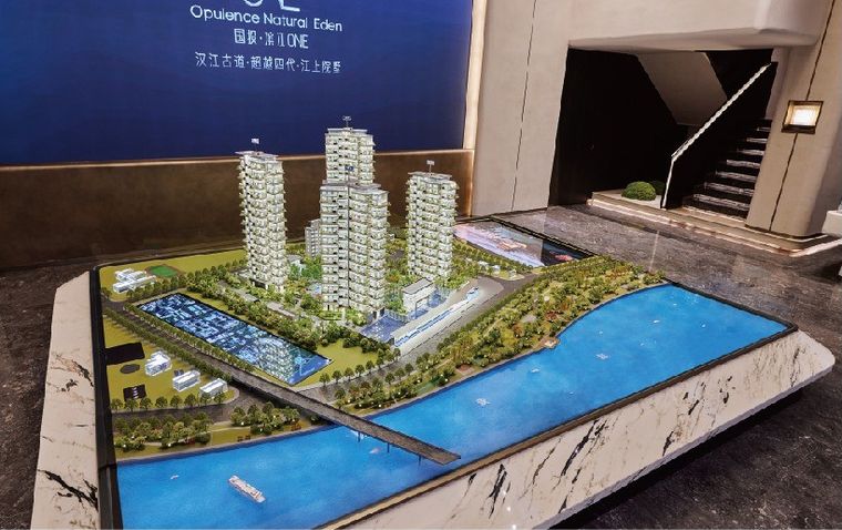 Model of a residential complex with the canal on a marble base