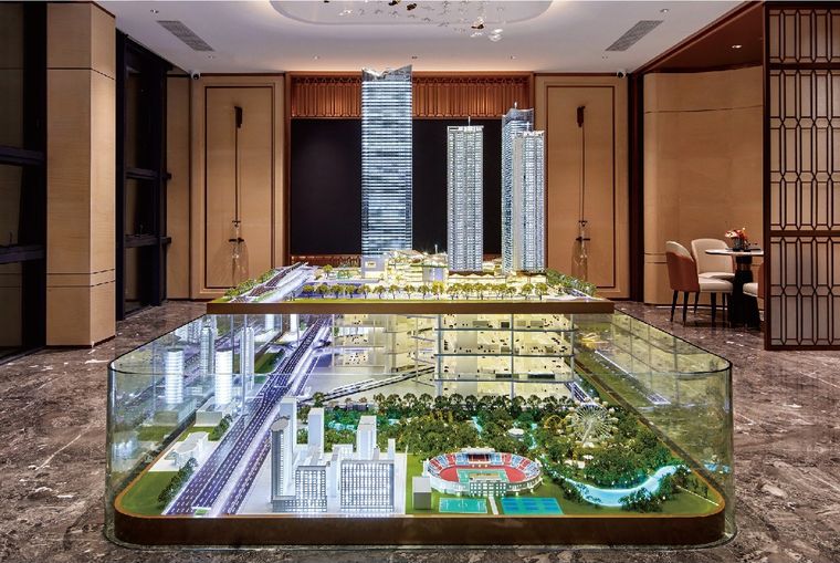 Model of a city inside a glass vitrine in a marble lobby