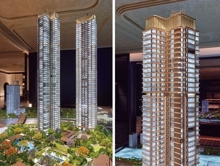 Two models of residential towers and a close view of a tower crown