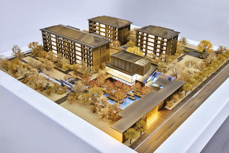 Low-rise residential buildings with pitched roofs and internal walkways