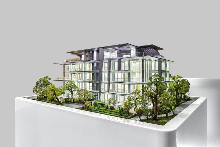 Low glazed residential building on a white base