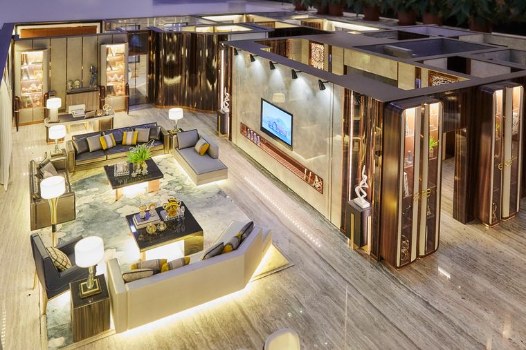 Interior cutaway of a luxury unit with fine lighting and miniature furniture