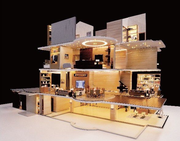 Cutaway model of a villa over three floors, fully furnished