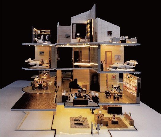 Cutaway model of a multi-level residence under warm light