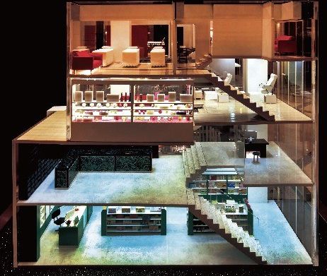 Cutaway model of a shop and café over four floors