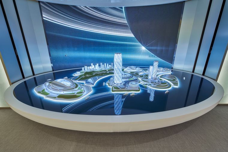 Illuminated island model under a digital display dome