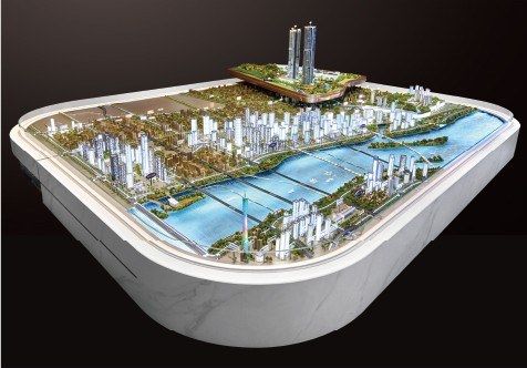 Model of a river city on an oval marble base