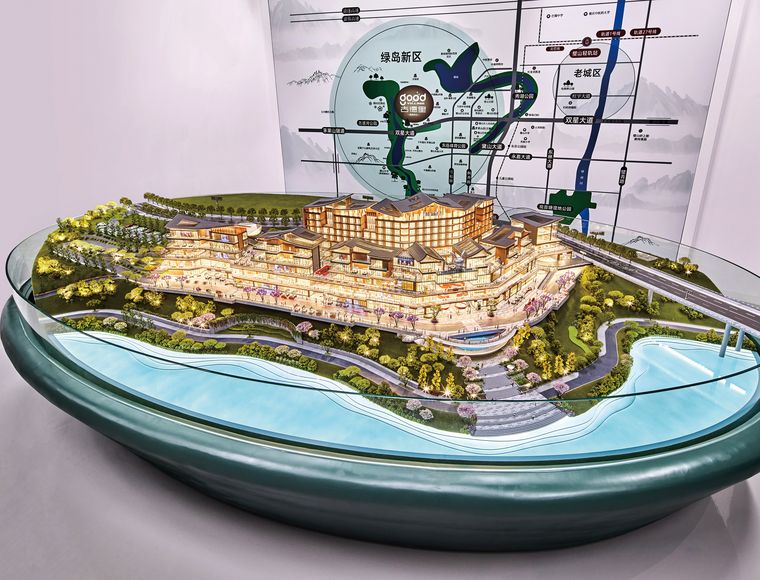 Retail complex on a slope with water around it