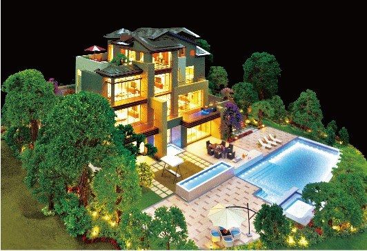 Model of a villa with tiled roofs and a pool surrounded by trees