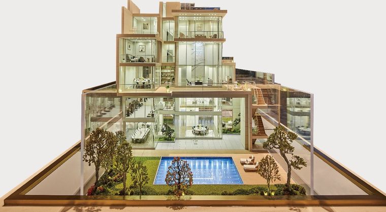 Cutaway model of a villa over four floors inside a glass vitrine