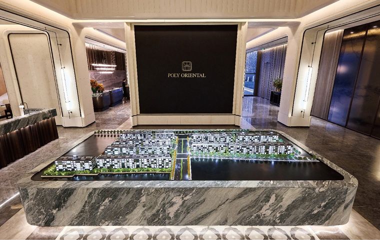 Model of a district of terraced villas on a display table in a marble lobby