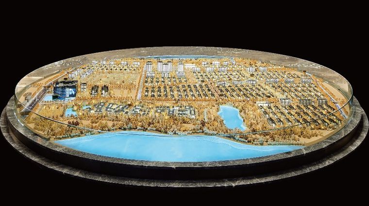 Model of a district of villas on an oval base against black