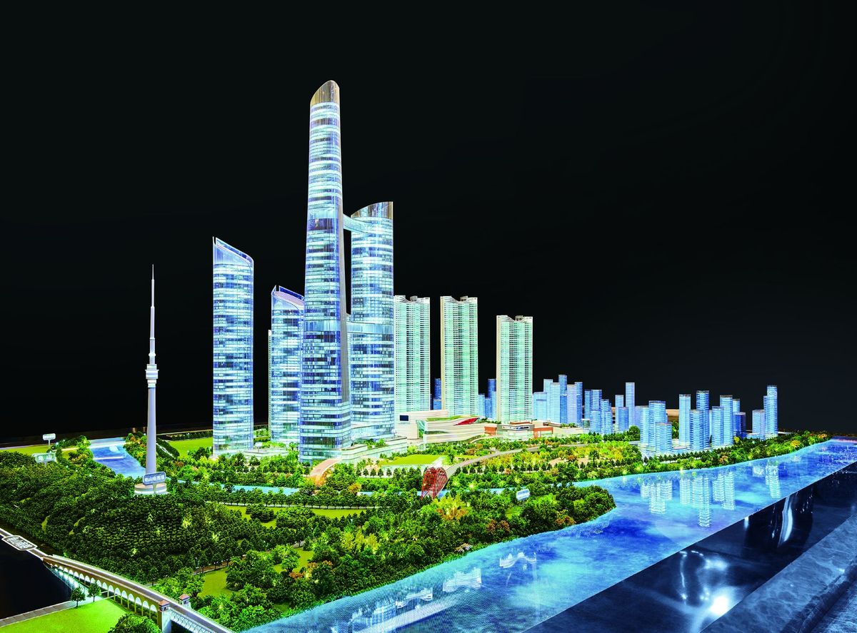 Illuminated city model in an exhibition hall